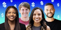 a group of people smiling in front of a blue background